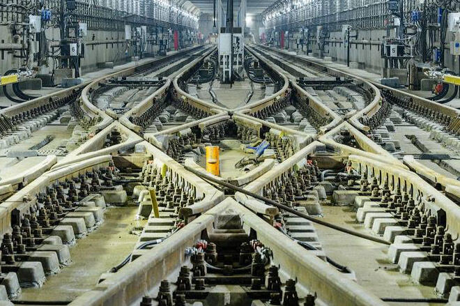 Complex systems, simple purpose: transformation that works. Close-up of industrial textile machinery with layered belts, spools, and gears—symbolizing precision, interdependence, and systems thinking.